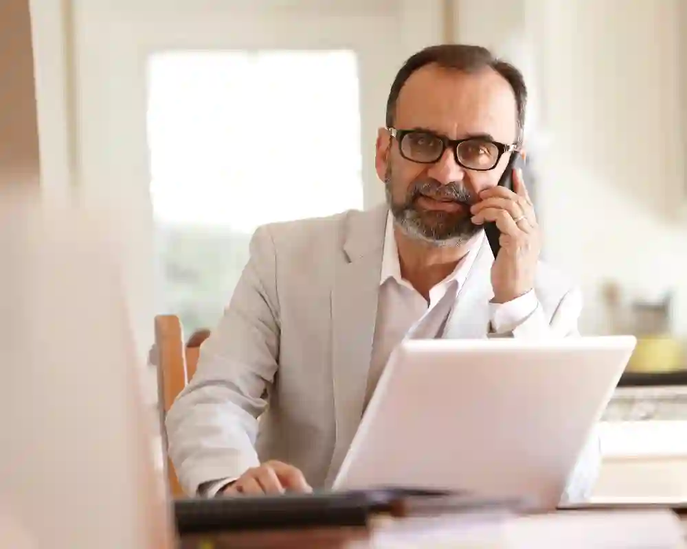 Small business owner discussing financing options while reviewing documents